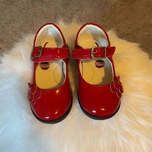 Toddler Stride Rite patent leather shoes.